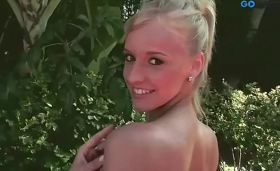 Natural blonde seductively teases outdoors in lingerie